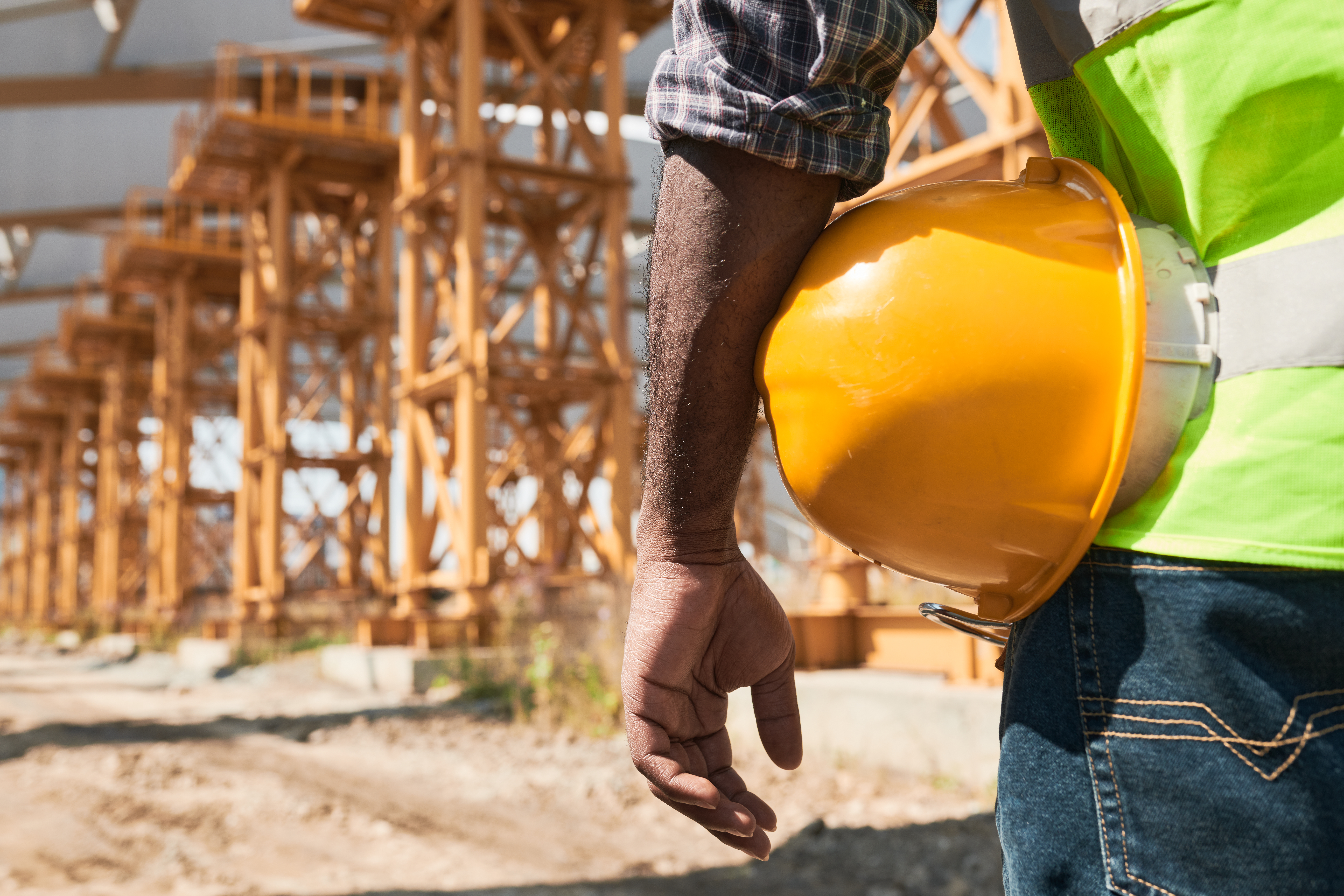Safety manager analyzing project plans on site